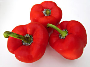 sweet red peppers: fresh bright red capsicums - red peppers