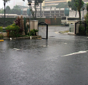 rainy day spatter: heavy rain downpour in carpark
