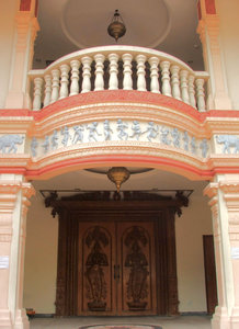 side entrance: Hindu temple side entrance for temple staff with balcony and carved decorated doors