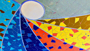 pavement mosaic: spiraling rainbow coloured pavement mosaic