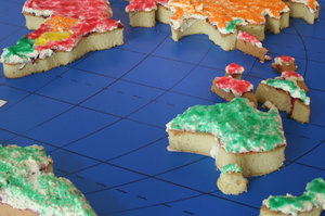 cake world: part of world map made and cut from cake and decorated