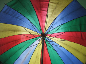 rainbow brolly: rainbow coloured umbrella