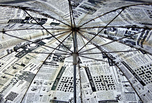 old news umbrella: unusual umbrella covered in newsprint-style material