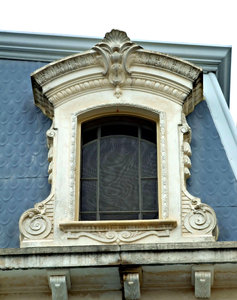 framed: ornamental Victorian stone-work dormer style window frame