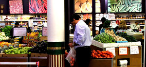 fruit & vegetable shopping: customers in a greengrocers store