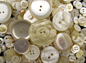 pearly buttons: a variety of different sized, shaped white & pearly buttons