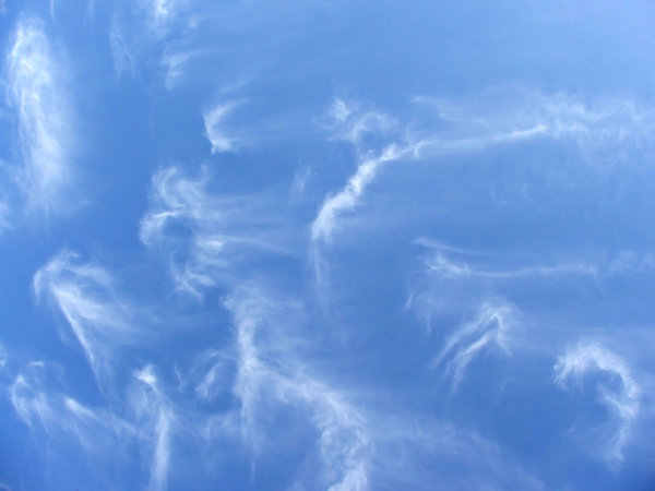 wispy clouds: thin streaks of fine cloud formations in blue skies