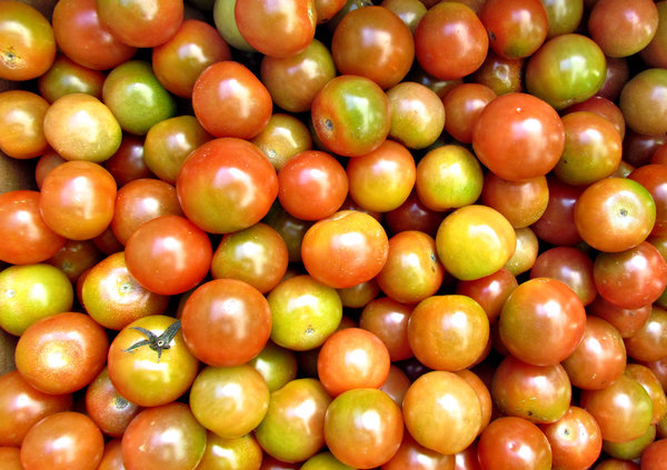 tomatoes - small round: small gourmet tomatoes - larger than cherry tomatoes but smaller than standard tomatoes