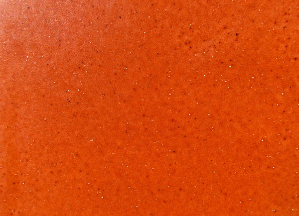 glazed orange tile: brightly coloured glazed orange tile1