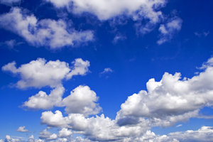 Dramatic Skies: Fluffy white clouds on a bright blue sky.