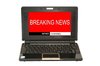 Breaking News: Laptop computer with breaking news screen