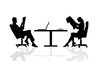 Business Table: Male and female business people at a desk