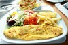 Omelette: Omelette with salad and chips on a plate