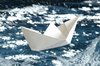 White Paper Boat: White paper boat on a rough blue sea