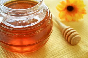 Honey Jar: Glass honey jar with wooden honey spoon