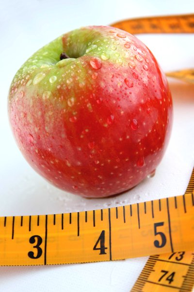 Apple & Tape Measure: Apple and tape measure healthy diet concept