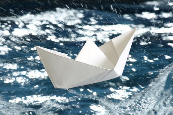White Paper Boat: White paper boat on a rough blue sea