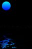 Blue Moon: Blue moon, reflected in water. Plenty of copyspace.