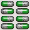 Medication Time 3: Green and clear tablets, capsules, or medication in clear plastic packaging. Perhaps you would prefer this image: http://www.rgbstock.com/photo/mhtN5KY/Medication+Time