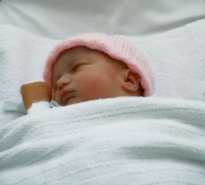 New Born Baby: A day old premature baby sleeping peacefully.