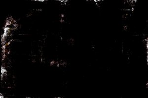 Black Grunge Background: A black, scratched grunge background. Lots of copyspace.