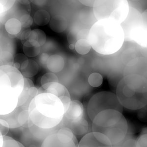 Bokeh or Blurred Lights 22: Bokeh, or blurred background lights in black and white. Suitable for a background, scrapbooking, xmas greetings, texture, or fill. You may prefer:  http://www.rgbstock.com/photo/nRFVI54/Bokeh+or+Blurred+Lights+11  or:  http://www.rgbstock.com/photo/mHMHFP