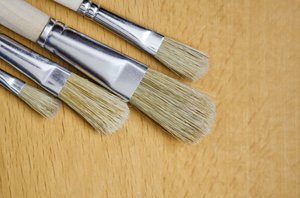 Brushes on wooden background: brushes on light wood