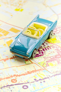 Car on map: Blue toy car on map