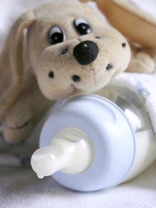 Baby blue: Blue baby bottle and toy