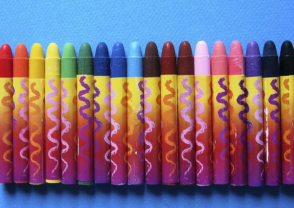 Crayons: wax coloring crayons on blue background